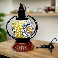 A decorative mosaic table lamp with multiple lights and an assorted design.