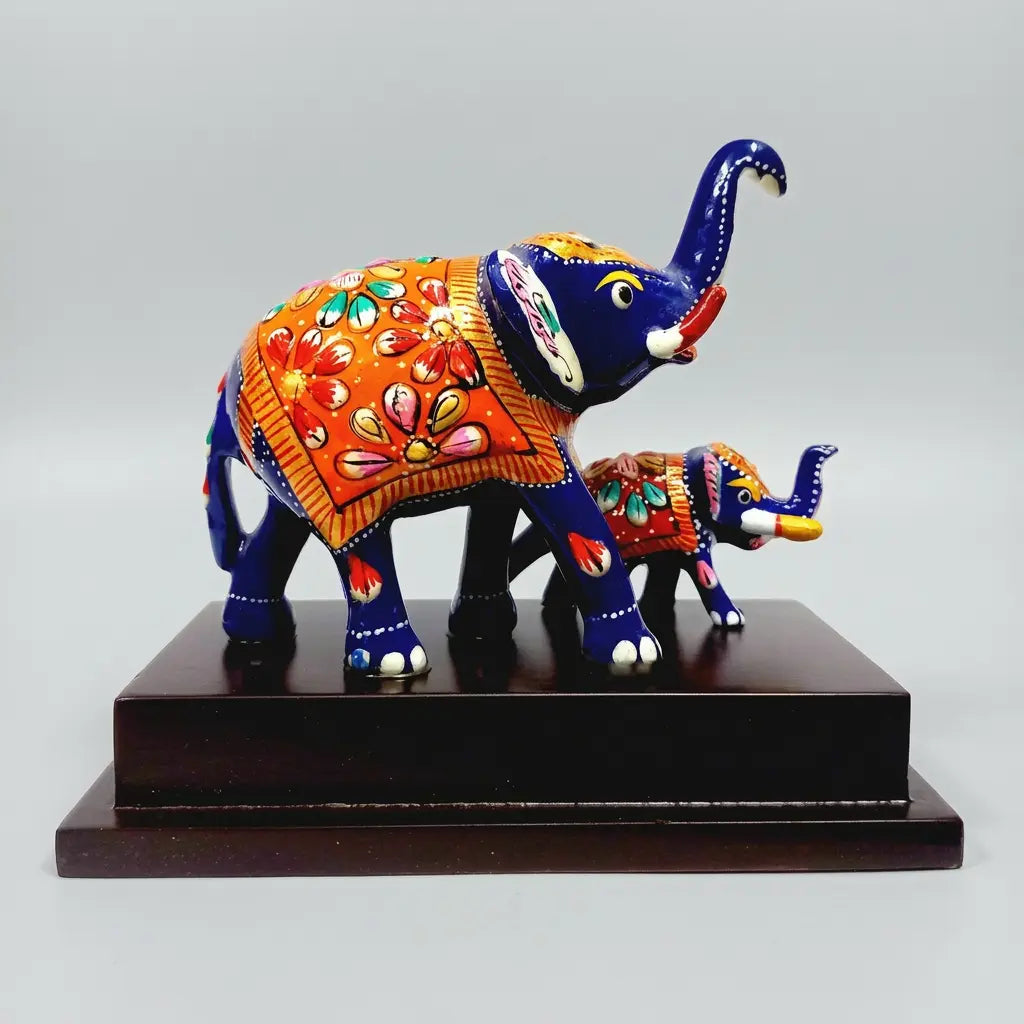Meenakari mother elephant standing beside her baby on a wooden platform
