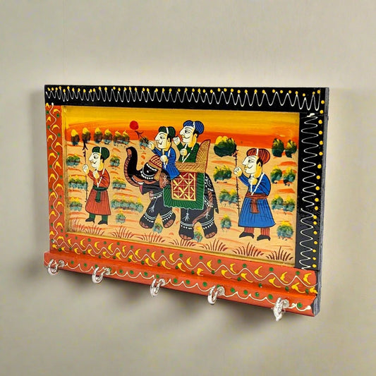 A wooden key stand with 5 hooks and a beautiful painting of Mughal kings.