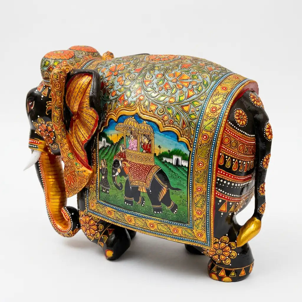 Rear angled view of Mughal miniature painted wooden elephant showing floral back patterns, a royal elephant scene and decorated legs