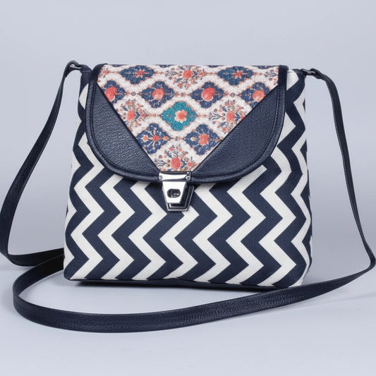 Front view of a 10x10 inch textured fabric sling bag for women with button closure