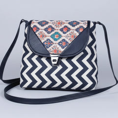 Front view of a 10x10 inch textured fabric sling bag for women with button closure