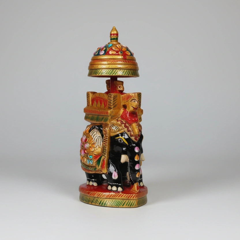 Close-up of pink, green, and red floral emboss painting on a golden painted base.