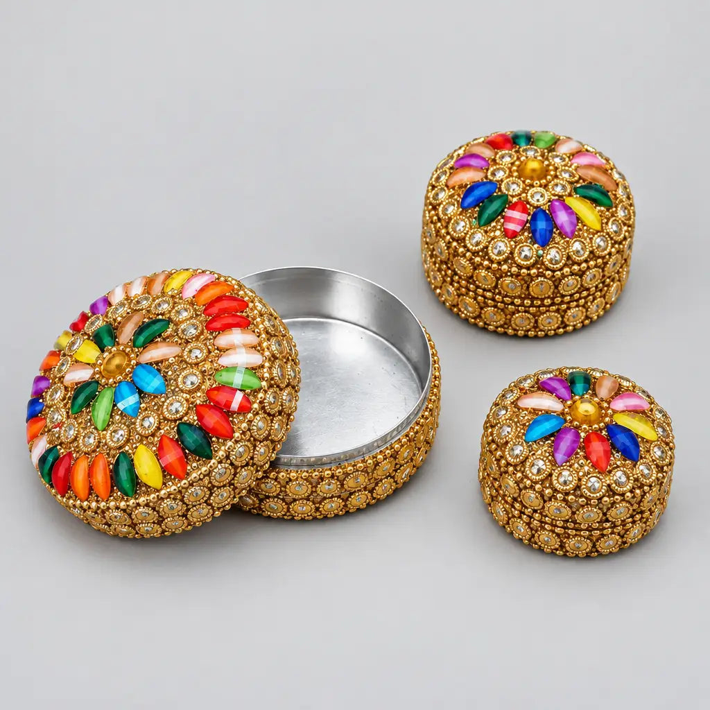 Multicolour lac box set with the largest box open, showing its metal interior and floral stone lid beside two smaller closed boxes.