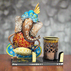 A Ganesha metal pen organizer for your office desk, perfect for keeping pens, pencils, and cards.

