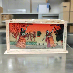 Office table desk organizer decorated with gemstone art behind glass.