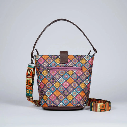 Rear view of the Patola print crossbody showing the functional back-side zipper pocket and smooth leatherette finish.
