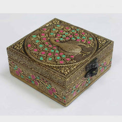 Elegant golden oxidized peacock motif on wooden gift box lid for royal wedding return gifts.