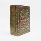 Side angle of handcrafted peacock meenakari wooden gift box with vibrant green and pink accents.