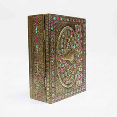 Side angle of handcrafted peacock meenakari wooden gift box with vibrant green and pink accents.