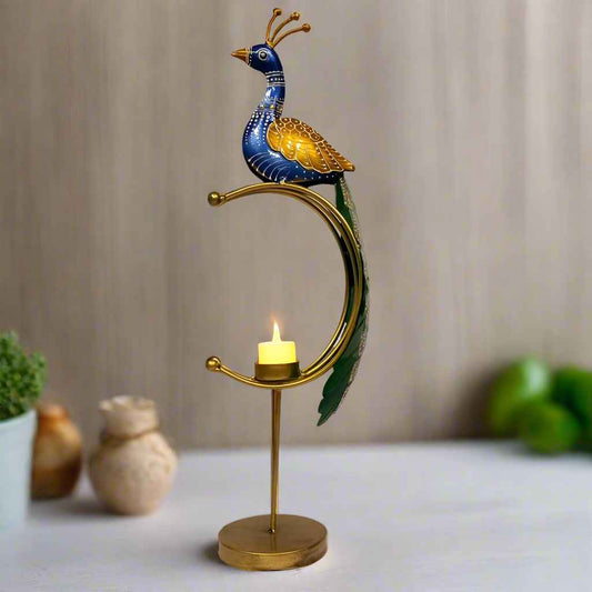 Antique-style metal tealight candle holder in elegant peacock design, featuring intricate feather detailing, vibrant enamel accents