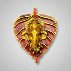 Decorative metal leaf Ganesh idol suitable for wedding return gifts and guest souvenirs.