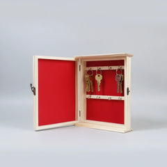 Inside view of 10.5x8.5 inch pine wood key holder with red velvet lining and 8 metal hooks.