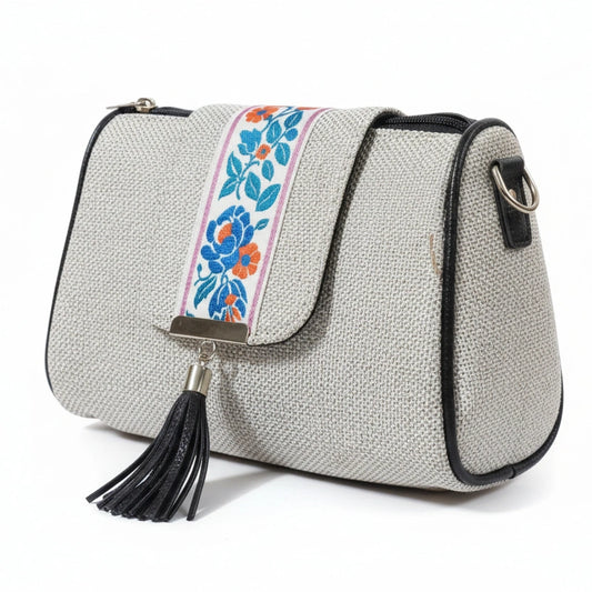 Women's premium jacquard woven sling bag with printed flap and leather tassel