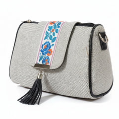 Women's premium jacquard woven sling bag with printed flap and leather tassel