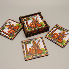 A designer wooden coaster on an office desk holding a glass of water, showing a stylish workspace setup.