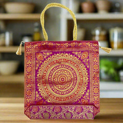 A pure silk bag with golden tassels and different zari artworks, perfect for everyday use.
