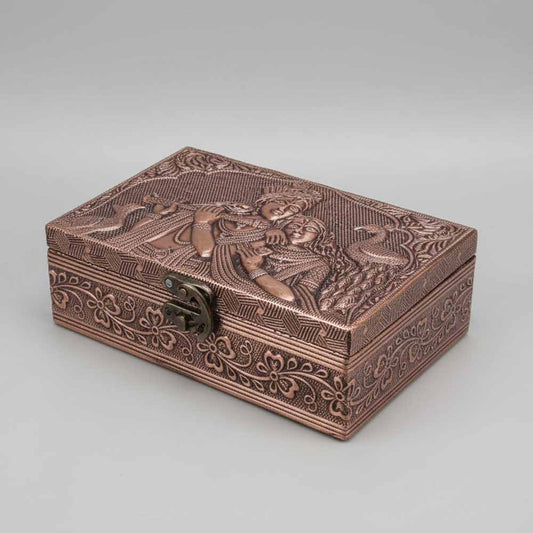 Premium wooden gift box with embossed Radha Krishna copper design and floral border on lid.