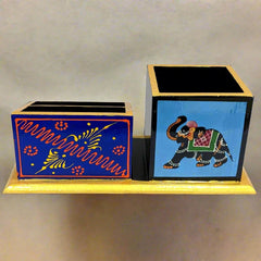A wooden desk accessory with Rajasthani art, perfect for a study room or office table.