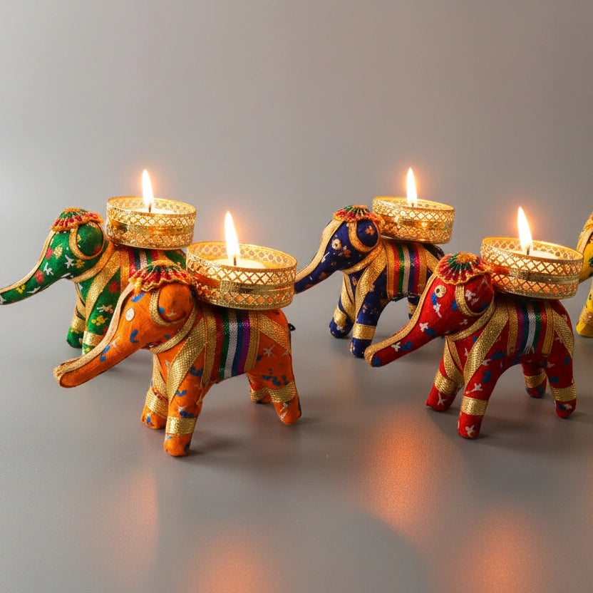 Set of 5 handmade Rajasthani elephant candle holders with vibrant cotton fabric and lace.