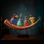Rajasthani folk dance and musicians table decor with hanging bells and a wooden platform against a dark teal background