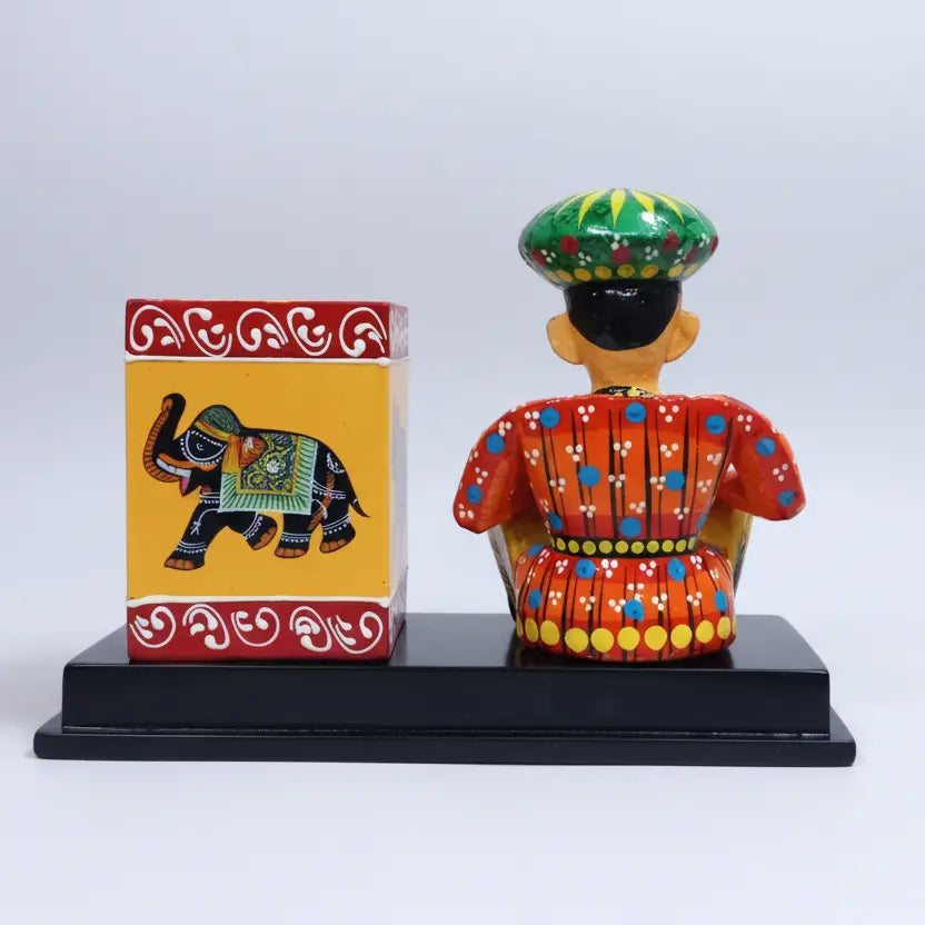 Back view of handcrafted Rajasthani folk musician pen stand solid wood base