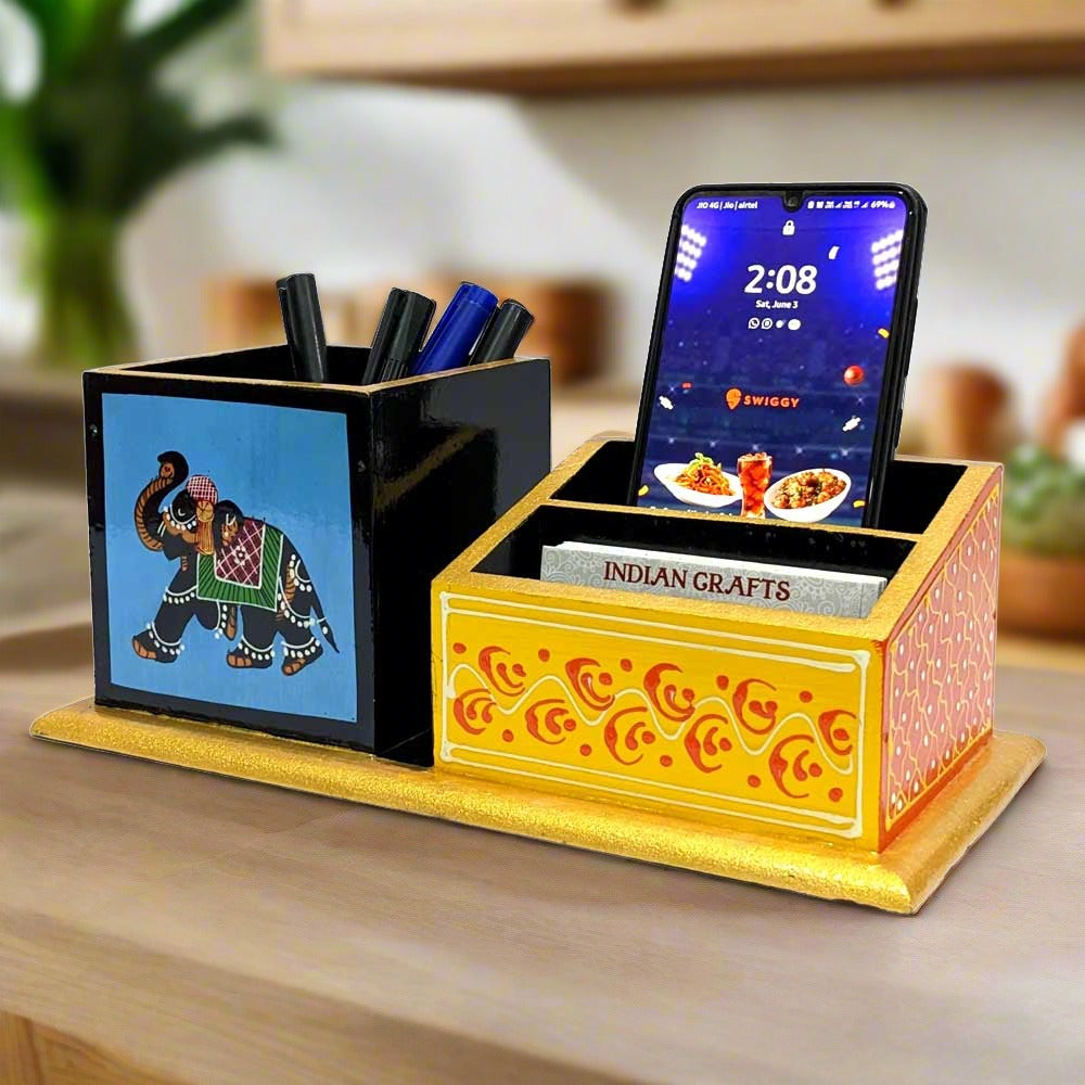 A wooden office desk organizer decorated with beautiful Rajasthani hand painting.