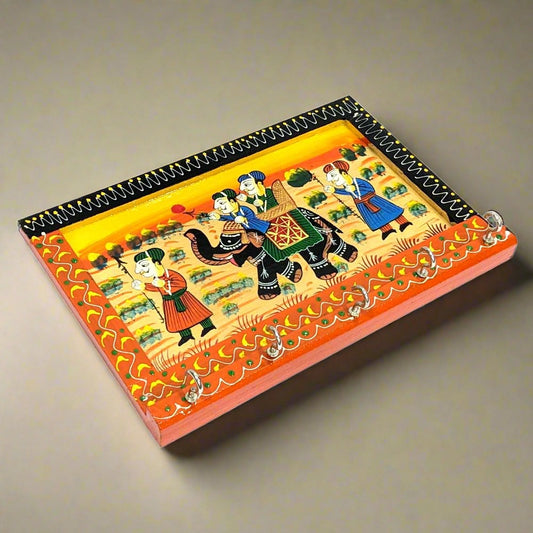 A Rajasthani hand-painted wooden key holder with an impressive Mughal kings painting.
