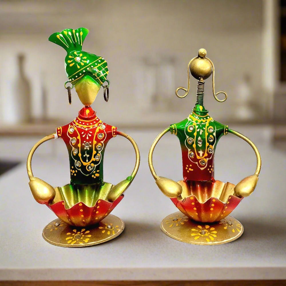 Hand painted Rajasthani man and woman metal figurine tealight holder set for ethnic decor gifts.