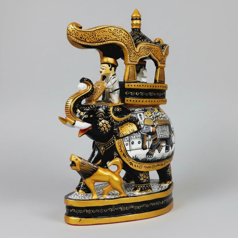 Close-up of intricate Rajasthani miniature painting and fine brushwork on a solid timber elephant statue.