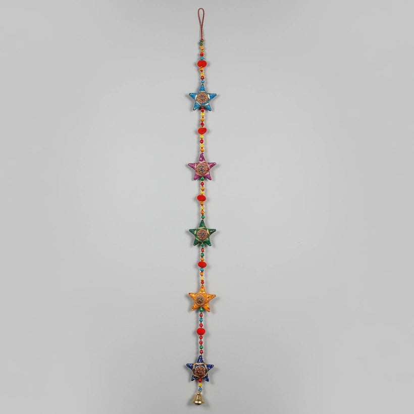 3 feet long handmade Rajasthani star-shaped wall hanging with hand-painted stars and decorative brass bell.