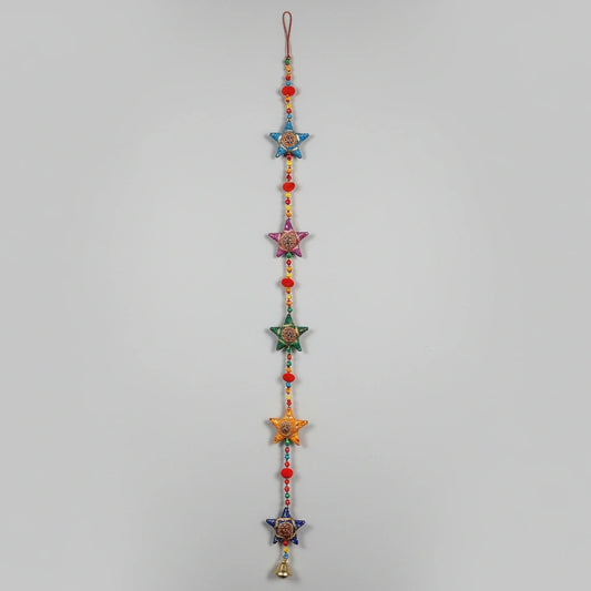 3 feet long handmade Rajasthani star-shaped wall hanging with hand-painted stars and decorative brass bell.