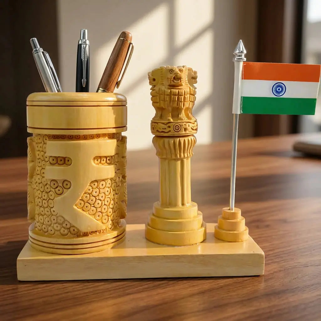 Close-up of a rupee symbol carved wooden pen holder holding three pens, with an Ashok Stambh and Indian flag on a rectangular base