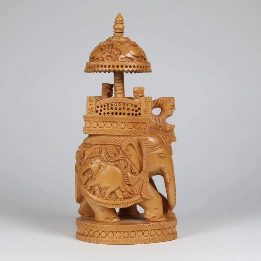 Detailed wood carving showcasing a Mahavat driver and two Kings seated in an ornamental palanquin.