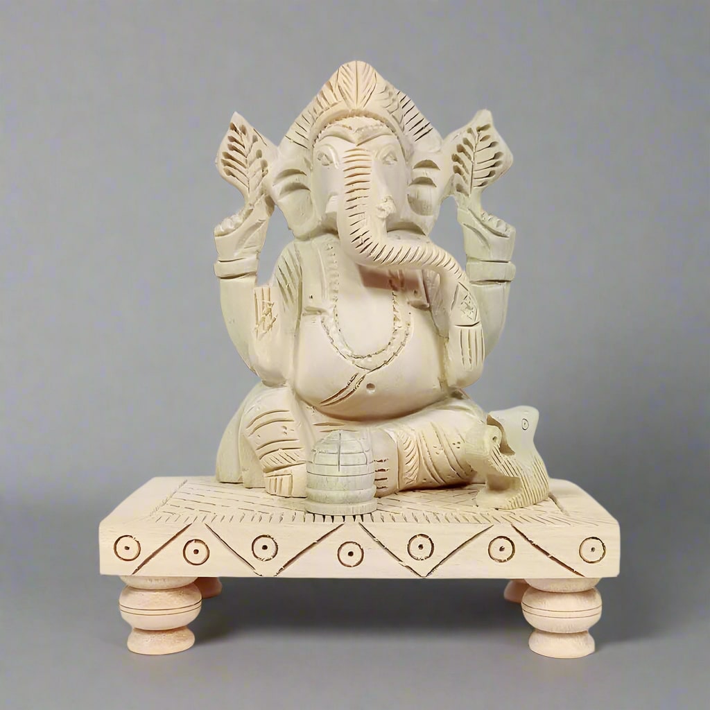 Handmade Sawan wood Chowki Ganesha idol with beautiful carving for worship.