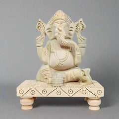 Handmade Sawan wood Chowki Ganesha idol with beautiful carving for worship.