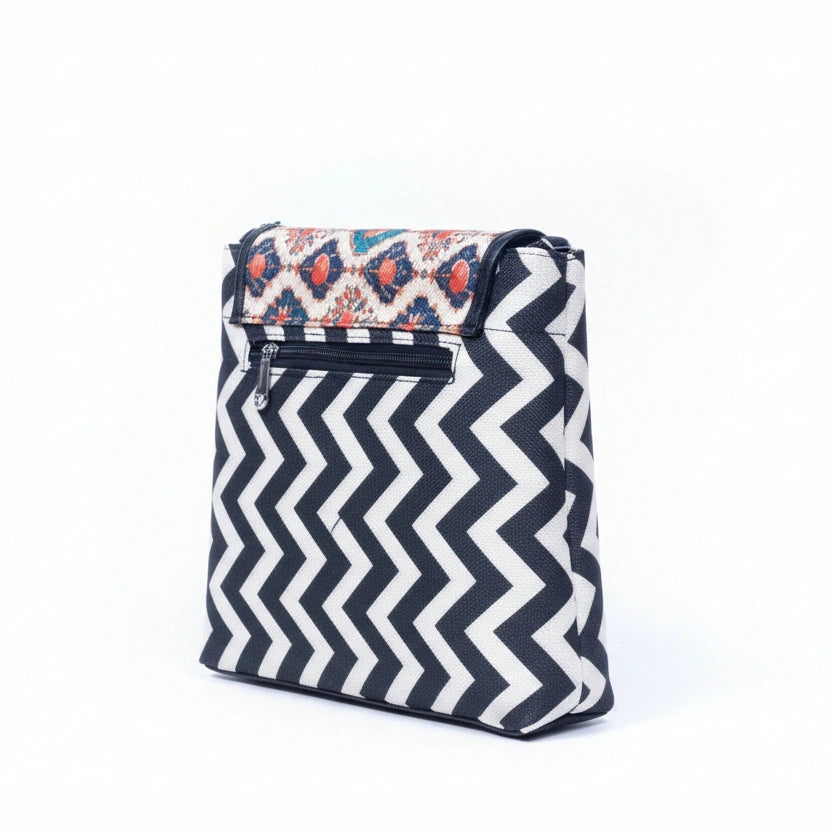 Rear view of the textured sling bag highlighting the secure back side zipper pocket