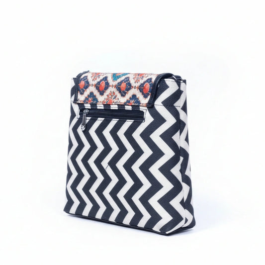 Rear view of the textured sling bag highlighting the secure back side zipper pocket