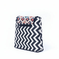 Rear view of the textured sling bag highlighting the secure back side zipper pocket