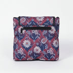 Rear view of the floral sling bag highlighting the secure back side zipper pocket