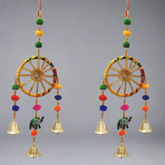 A set of two decorative wall hanging torans, with vibrant colors and designs.