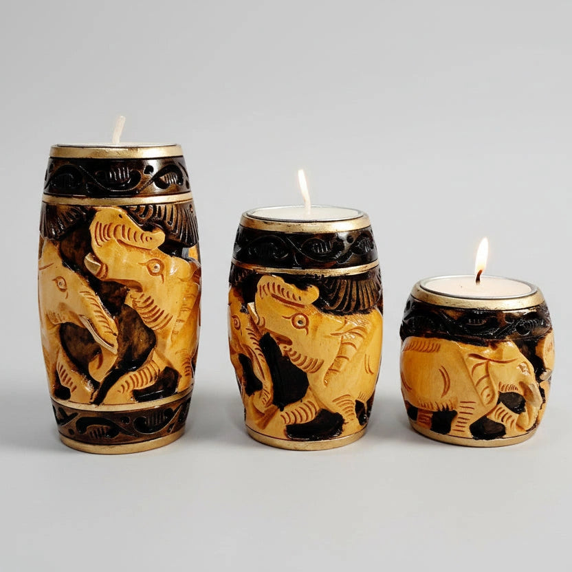 Set of 3 wooden elephant candle holders featuring a 2-tone natural wood and brown painting finish.
