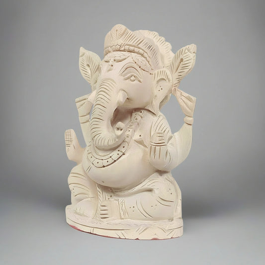 Side profile of the 13cm Shriparni Ganesh statue showing the natural wood grain and 5cm depth.