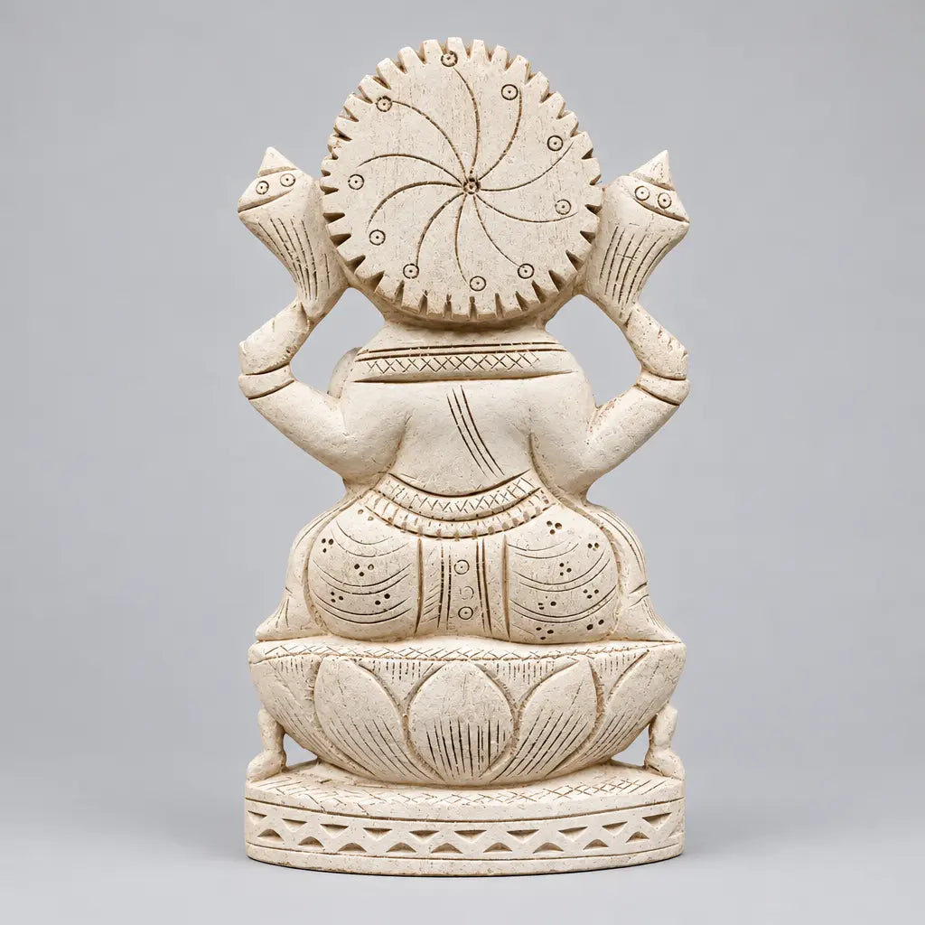 Back view of a Shreeparni wood Ganesha statue showing the circular carved halo, robe details and lotus pedestal