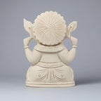 Shriparni Sevan wood Ganesh statue placed in a traditional Indian home temple for Vaastu benefits.