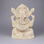Handcrafted 13cm Shriparni Sevan wood Ganesh statue for home pooja and wealth prosperity.