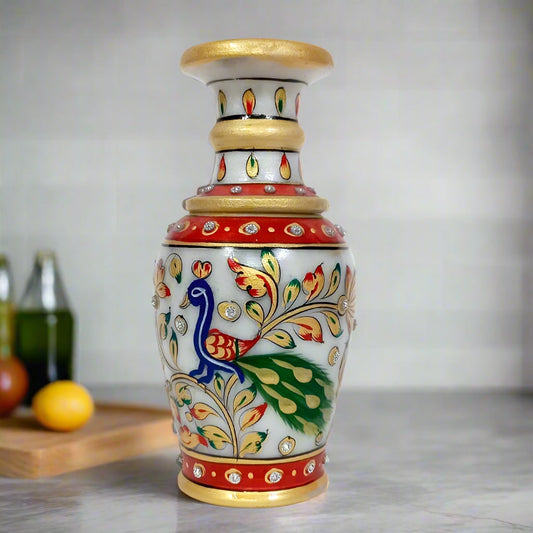 A small, decorative marble flower pot, perfect for a tabletop or shelf.