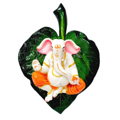 A spiritual Ganesha on a green leaf, a unique wall sculpture for home decor.
