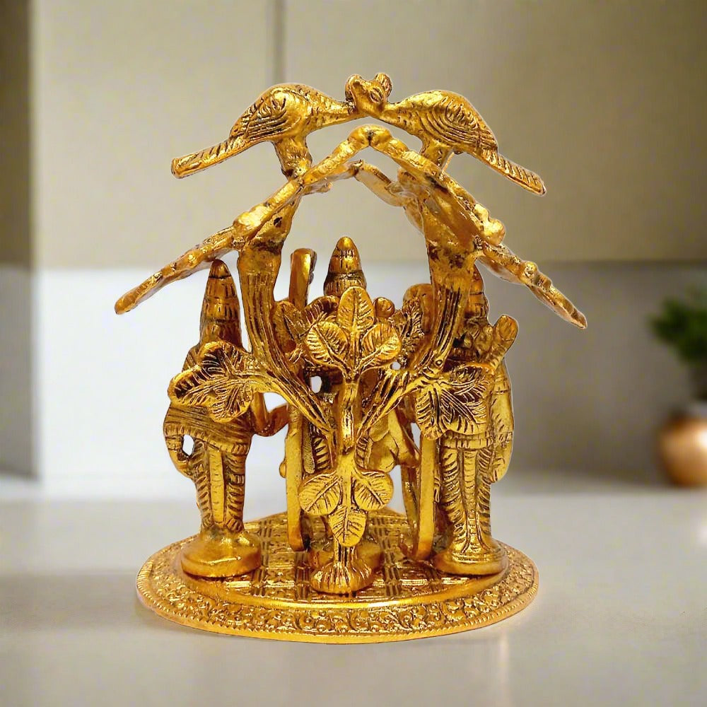 A metal statue depicting Lord Rama, Sita, Lakshman, and Hanuman standing together.