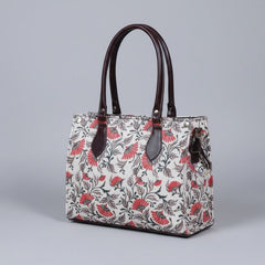 Close-up of the reinforced strong PU leather handle on the fabric hand bag.